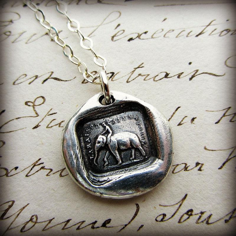 Guy riding an elephant wax seal necklace