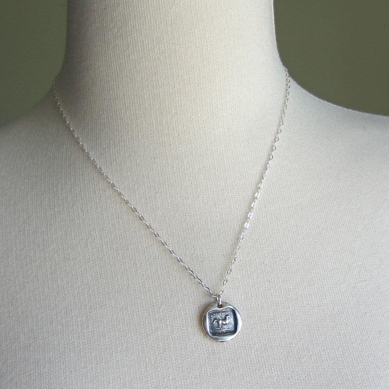 Horse wax seal necklace on a mannequin