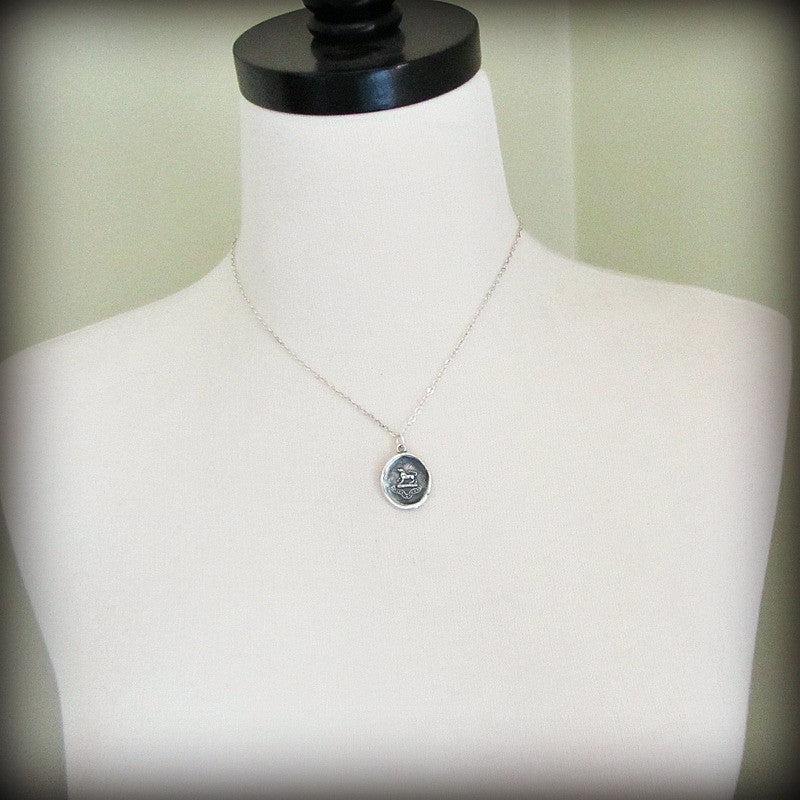 Wolf Wax Seal Pendant Necklace on a mannequin