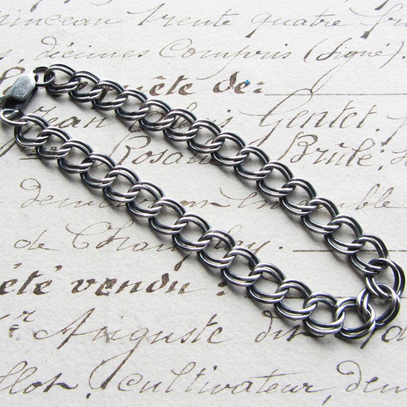 Charm bracelet dark size 7 on paper