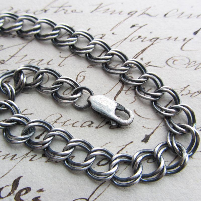 Charm bracelet dark size 7 close up