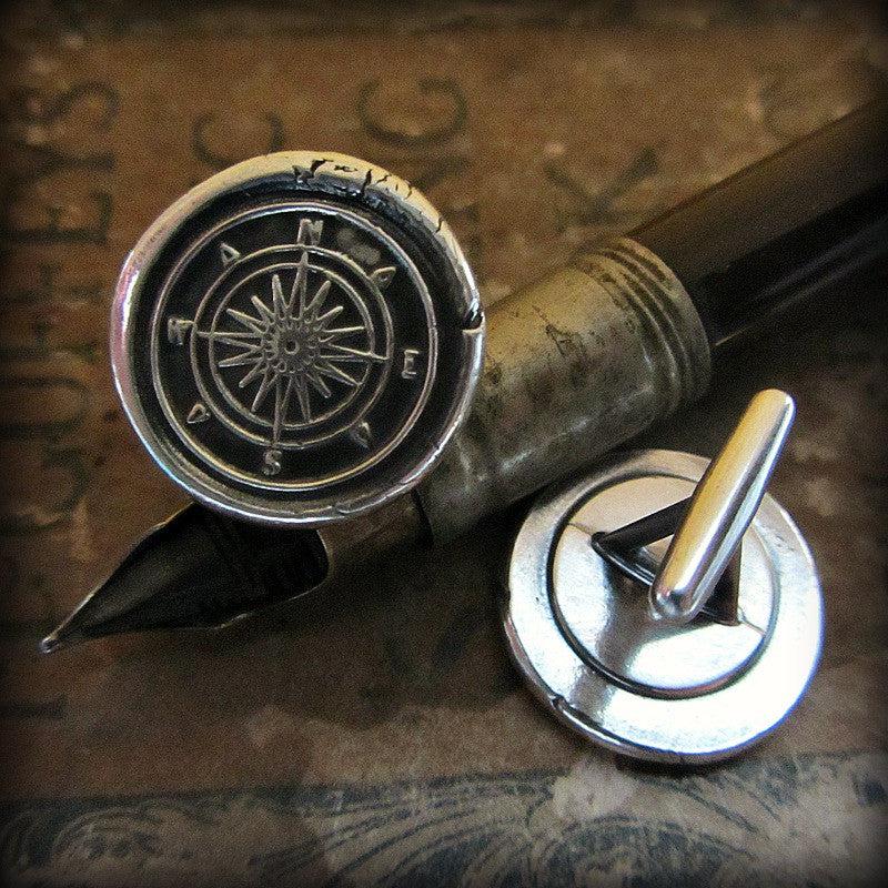 Compass cuff links on a pen
