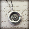 Dragon wax seal necklace close up view
