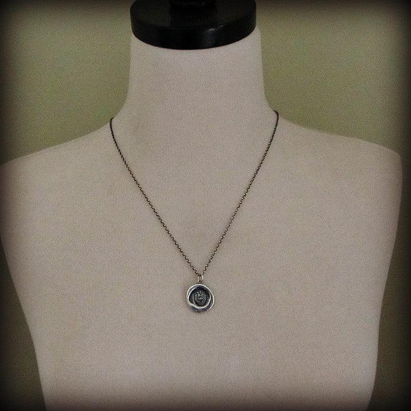 Dragon wax seal necklace on a mannequin