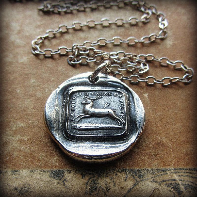 Wounded heart wax seal necklace with a chain