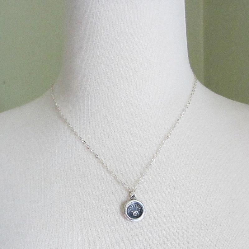 Faithful Dog Wax Seal necklace on a mannequin