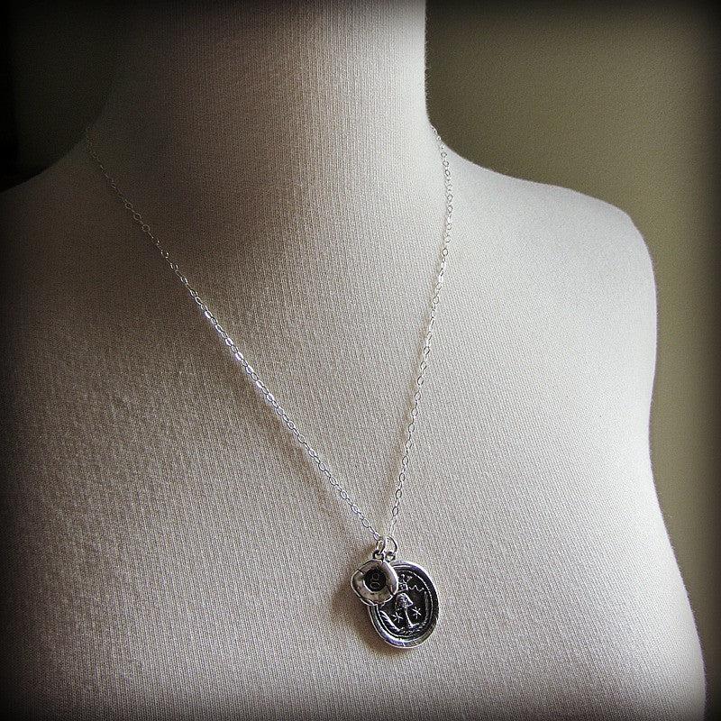 Family tree wax seal necklace on a mannequin