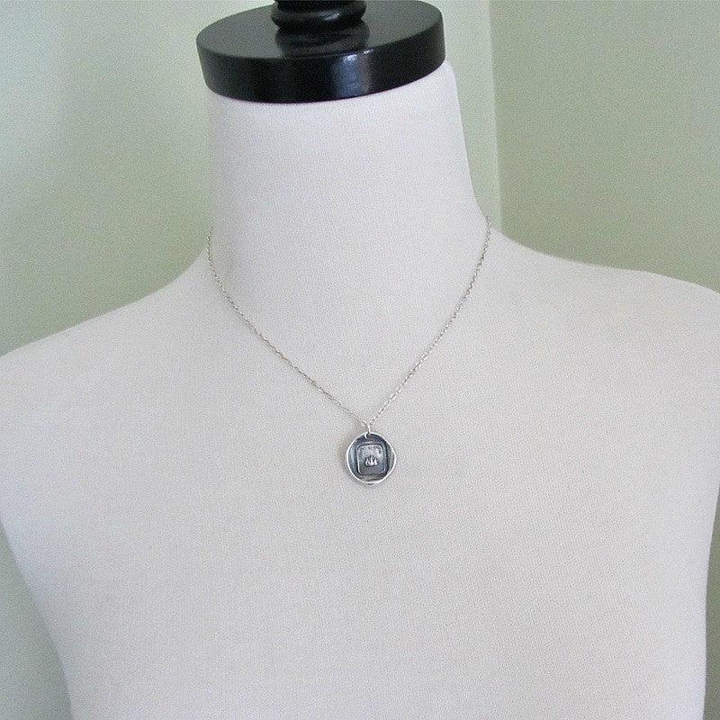 Fire Wax Seal necklace on a mannequin