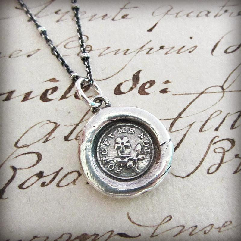 flower forget me not wax seal necklace with silver chain