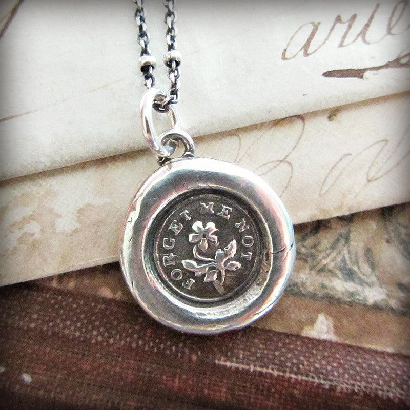flower forget me not wax seal necklace with silver chain