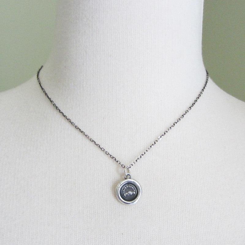 Friendship with hands wax seal on a mannequin