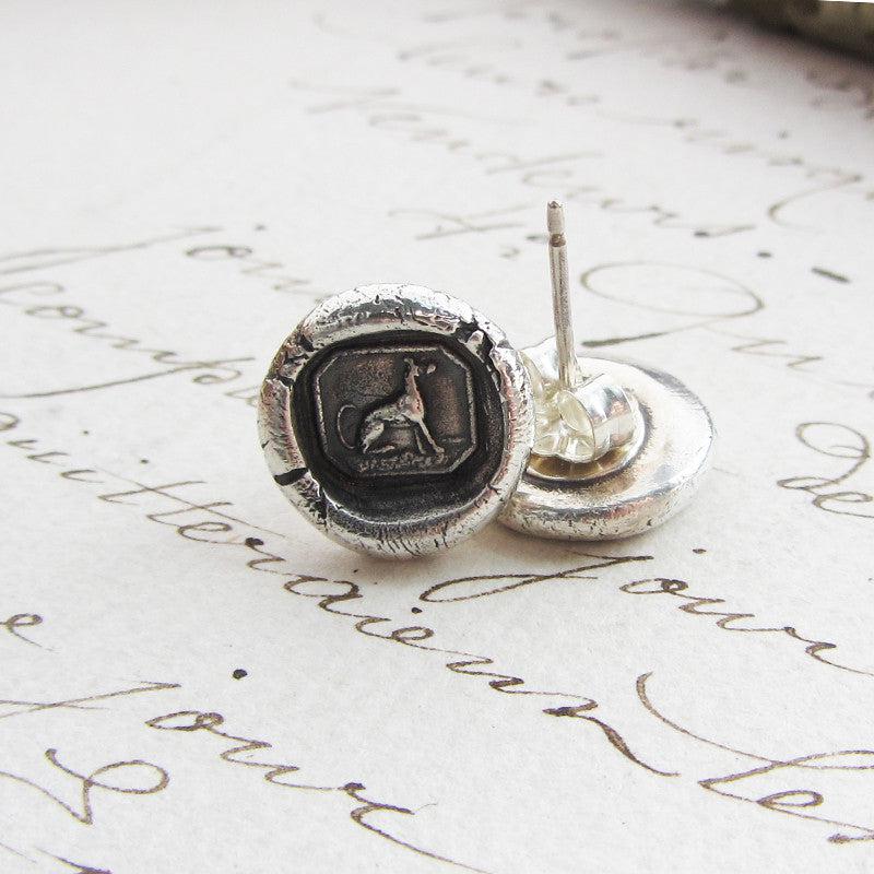 Greyhound Wax Seal Stud Earrings on paper