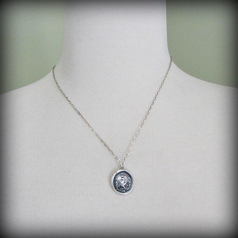 Griffin wax seal necklace on a mannequin