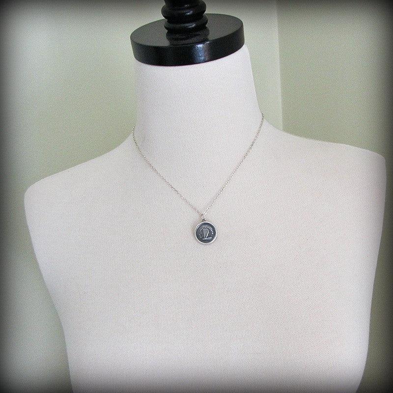 Harp harmony wax seal necklace on a mannequin