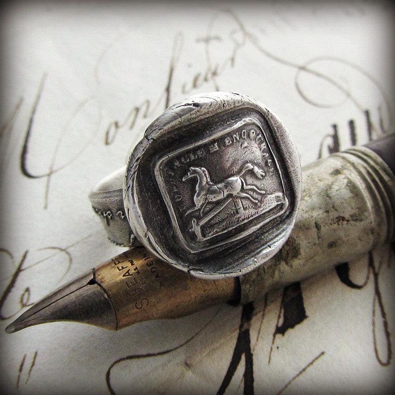 Horse obstacles wax seal ring on a pen
