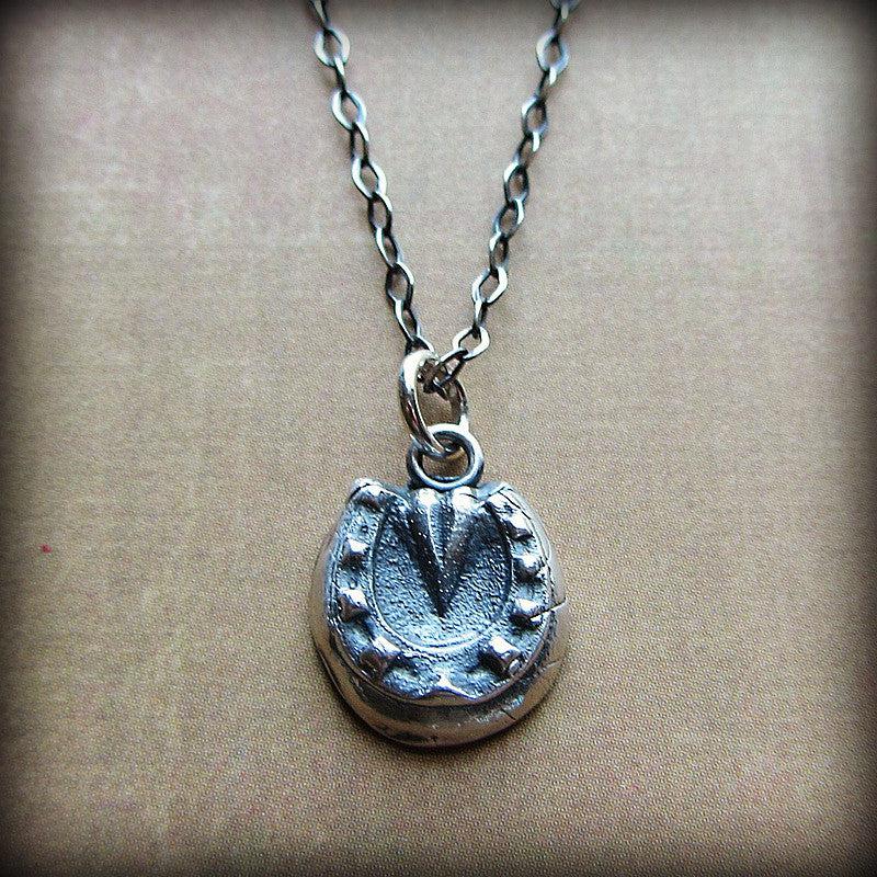 Horseshoe wax seal necklace white bg