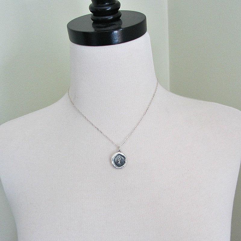 Buck wax seal necklace on a mannequin