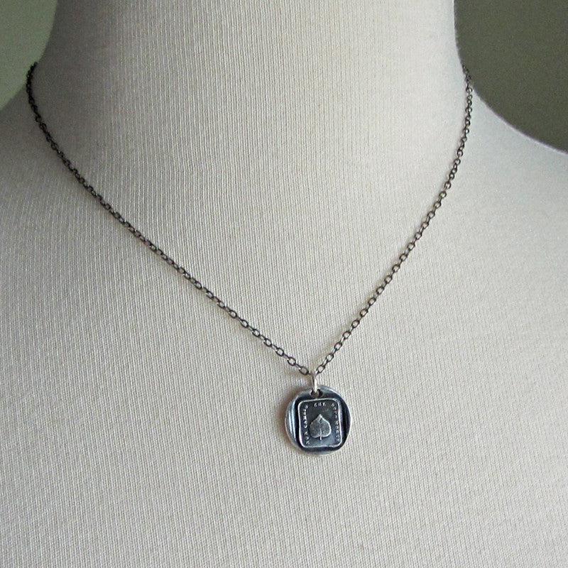 Leaf wax seal necklace on mannequin