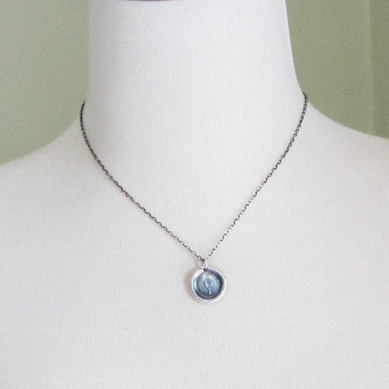Mirror wax seal necklace with a mannequin
