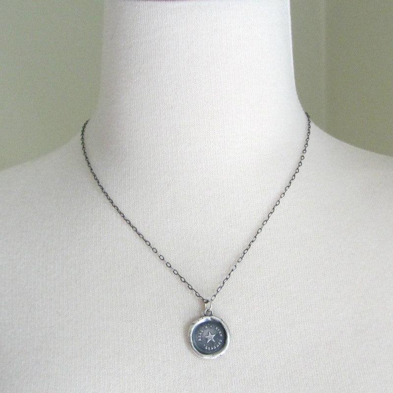True North Star Wax Seal Necklace on a mannequin