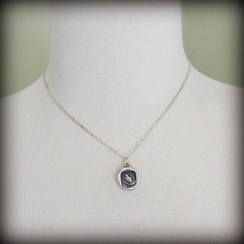 Owl with prey wax seal necklace on a mannequin