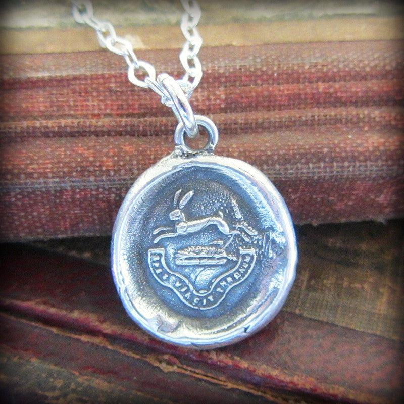 Rabbit wax seal necklace on paper
