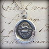 Rabbit wax seal necklace on paper