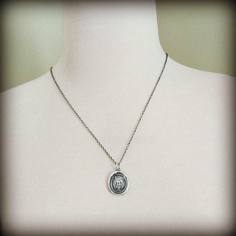 Can can girl wax seal necklace on a mannequin