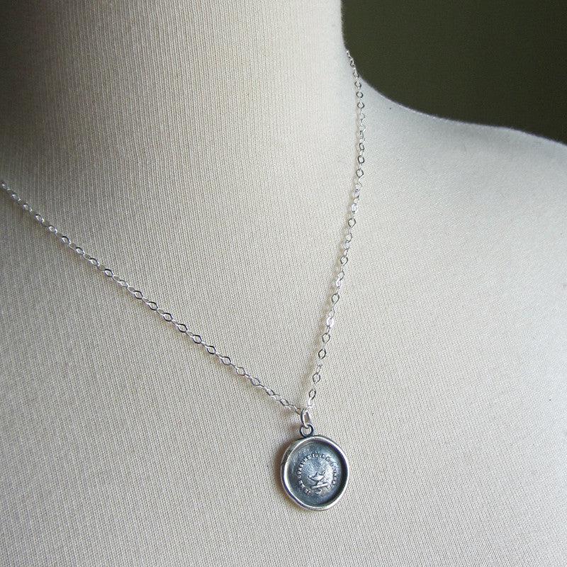 Genie lamp wax seal necklace on a mannequin