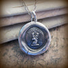 Buck wax seal necklace close