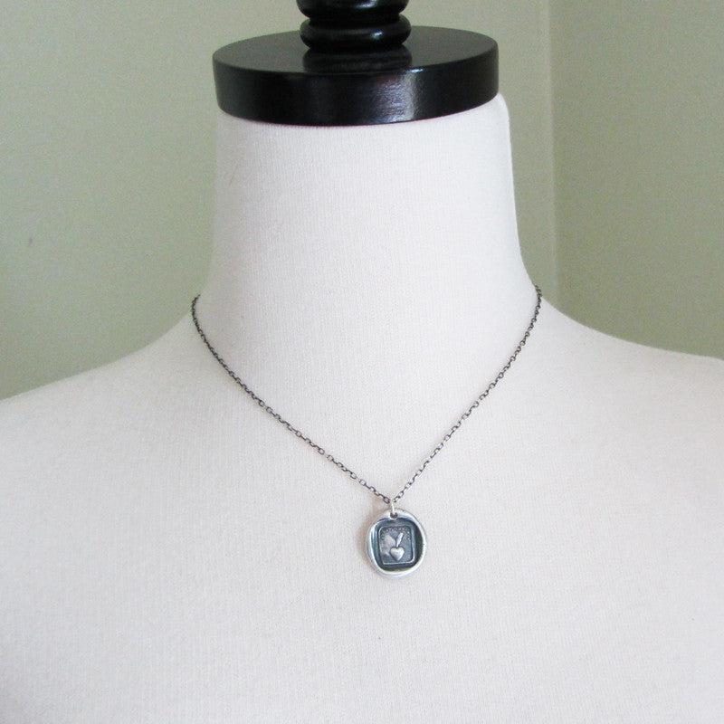 Heart and feather wax seal necklace mannequin