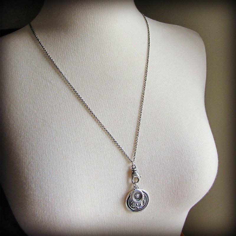 Wax Seal Charm Holder dark on a mannequin