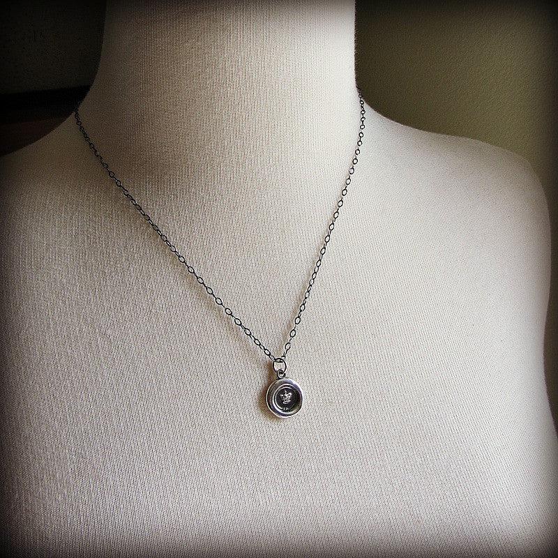 Tiny Crown Wax Seal on a mannequin