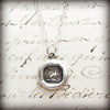 Tiny Greyhound Wax Seal Charm on paper