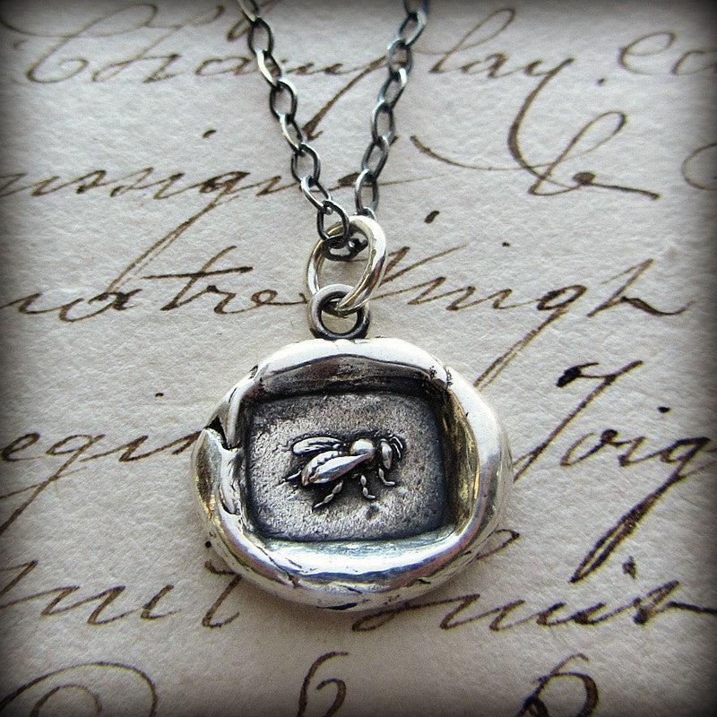 Vintage Honey Bee Wax Seal Necklace on paper