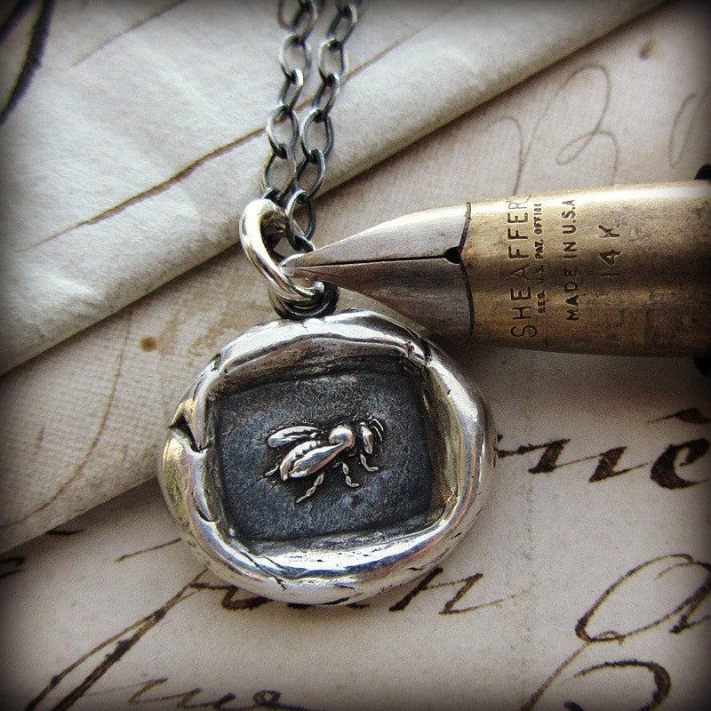 Vintage Honey Bee Wax Seal Necklace on paper