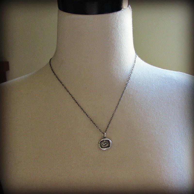 Vintage Honey Bee Wax Seal Necklace on a mannequin