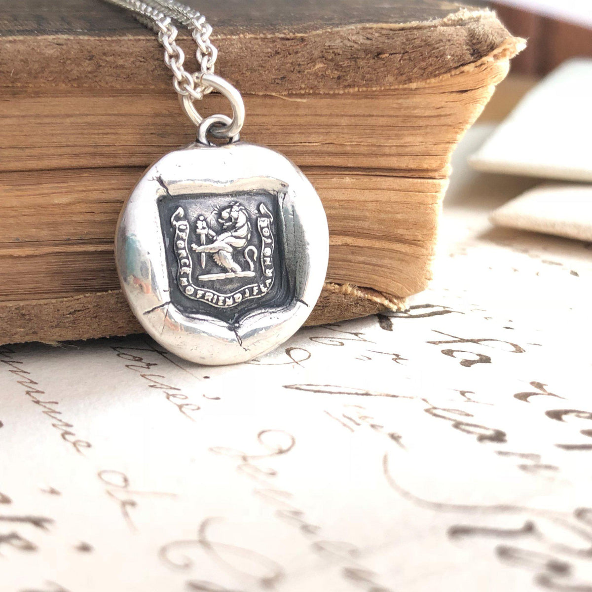 Lion and sward wax seal necklace