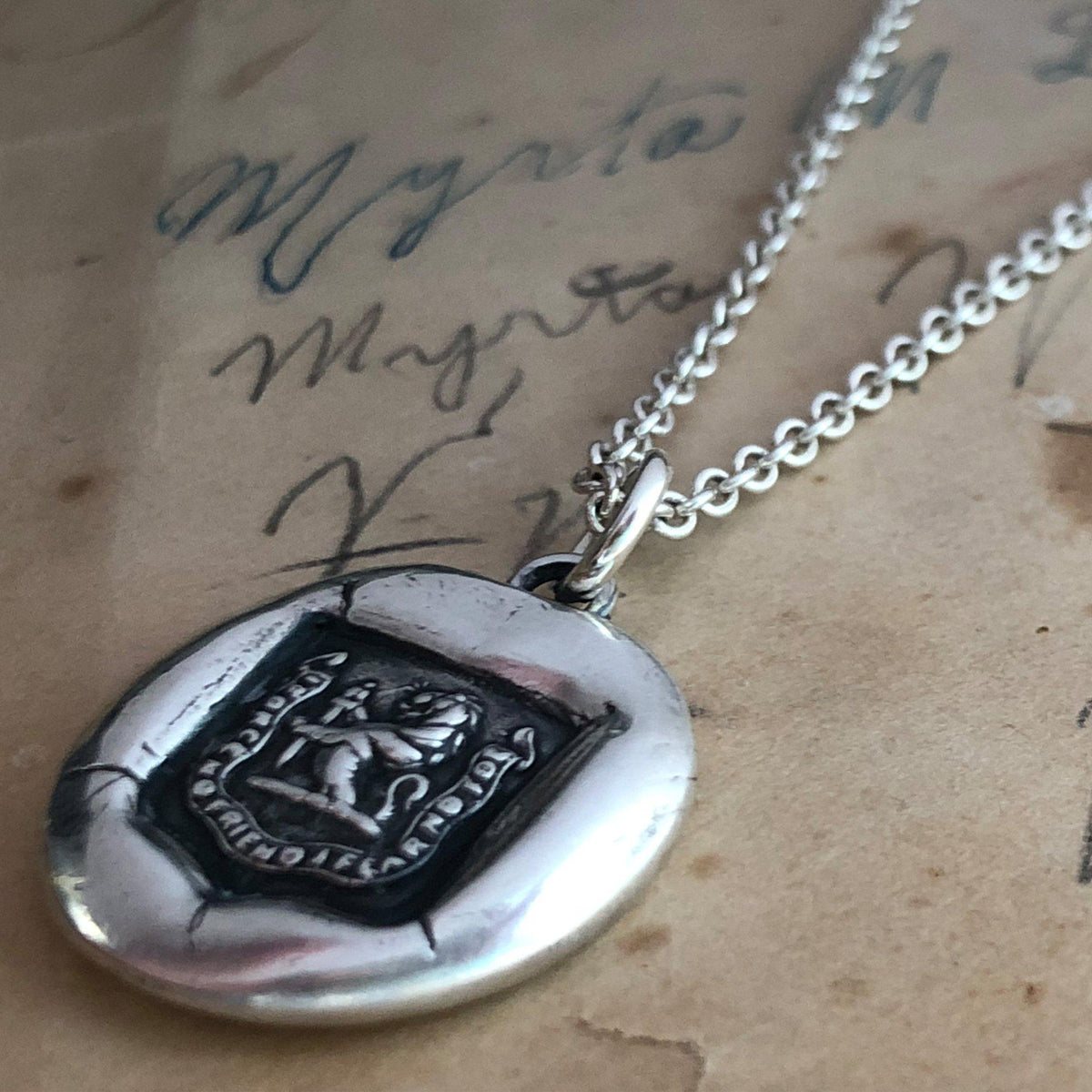 Lion and sward wax seal close up shot