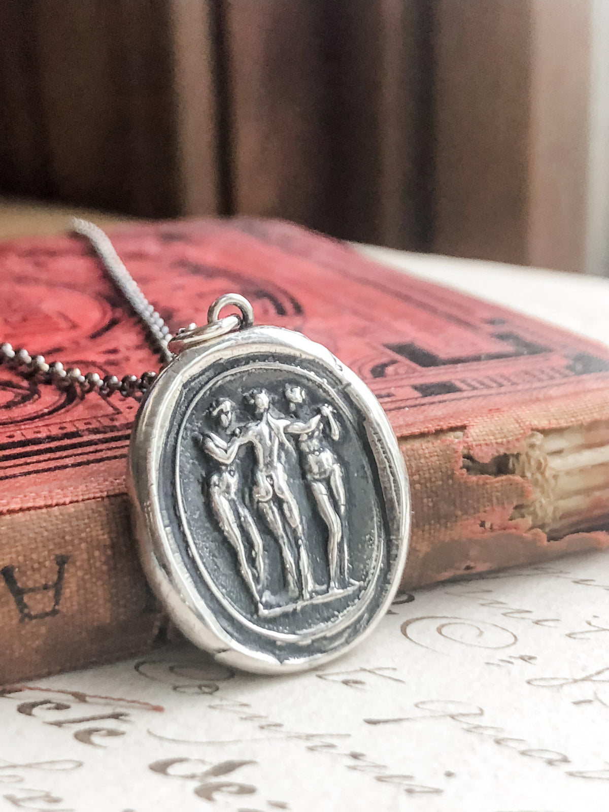 3 people wax seal jewelry