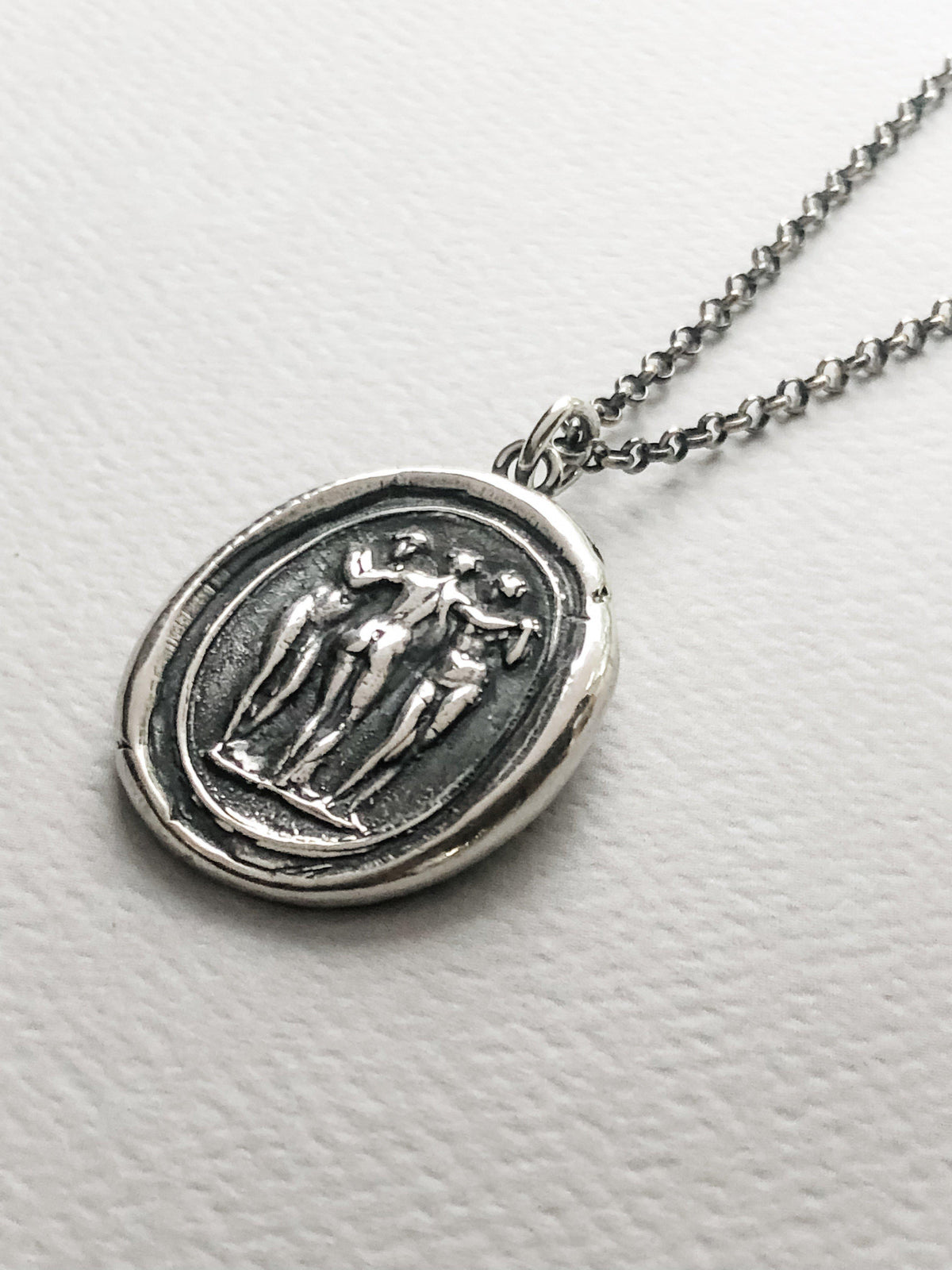 3 people wax seal necklace close