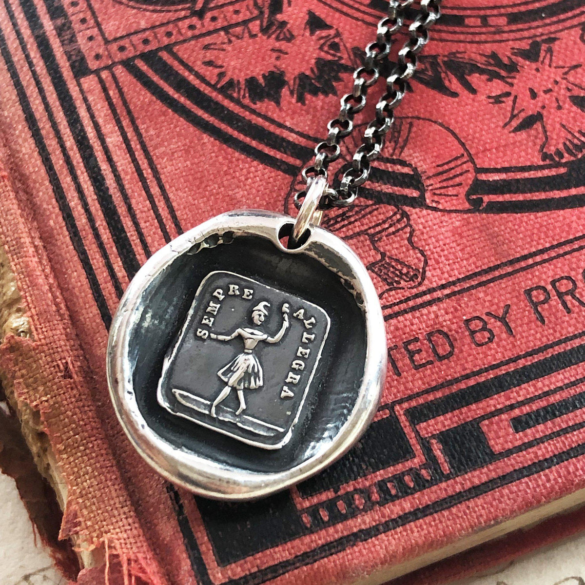 Always glad wax seal necklace on red background