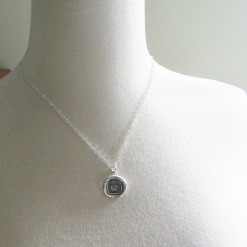 butterfly wax seal charm on a mannequin