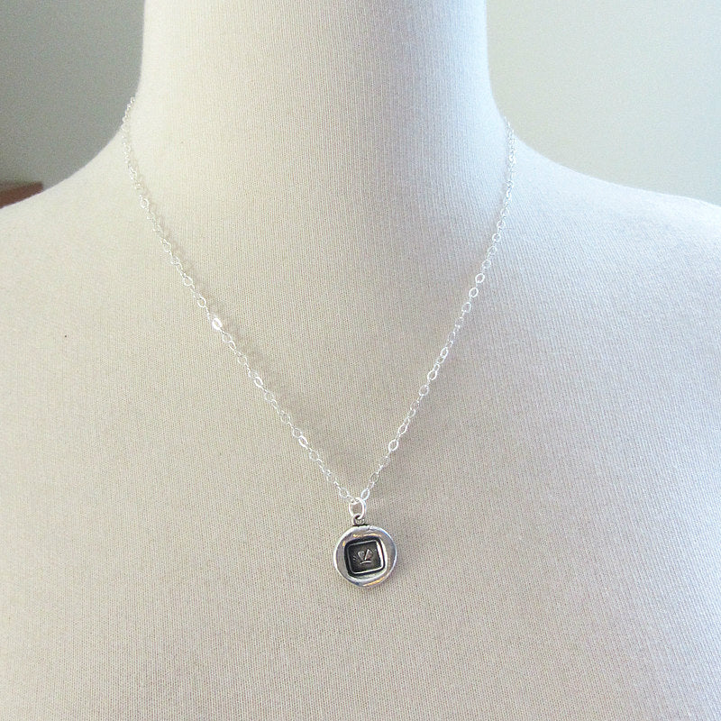 Butterfly wax seal necklace on a mannequin