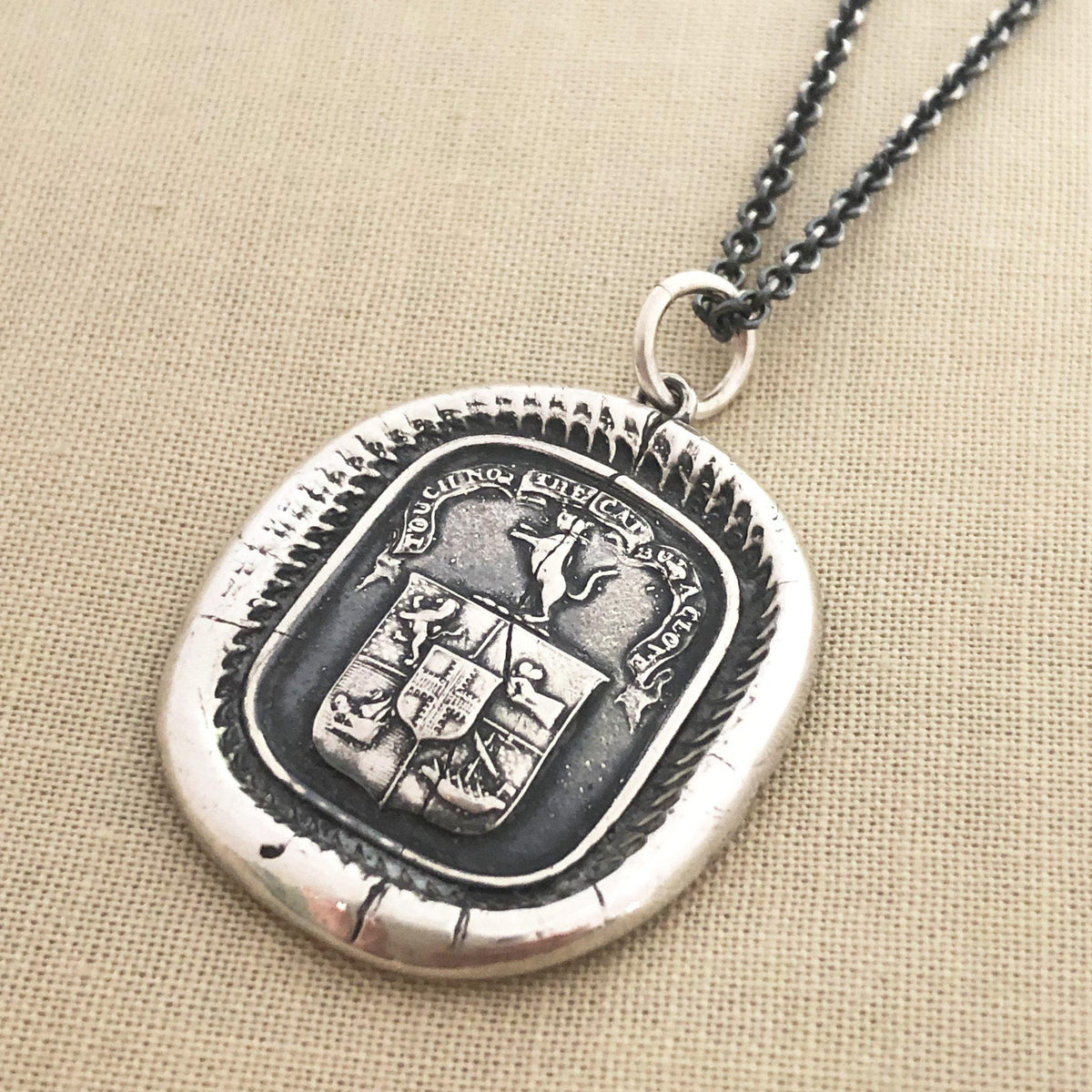 Cat wax seal crest necklace with dark chain