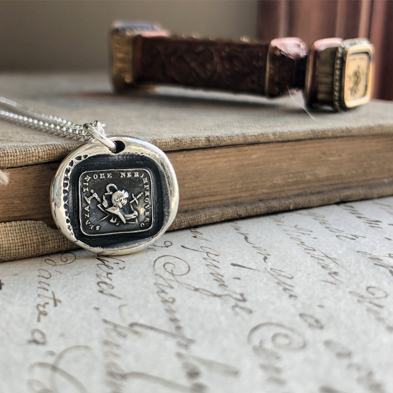 Courage wax seal over a book