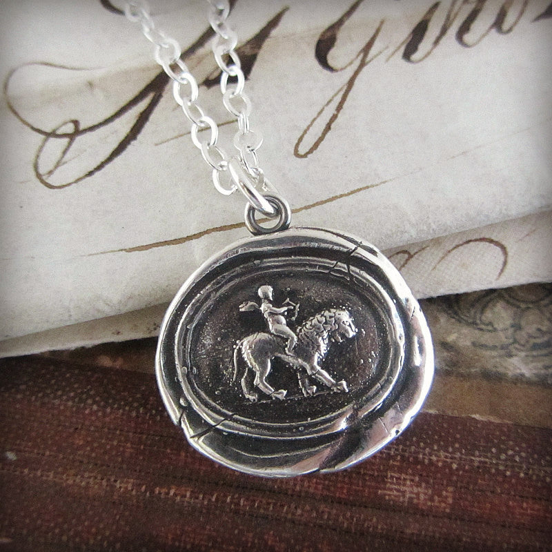 Cupid on a lion wax seal necklace close up