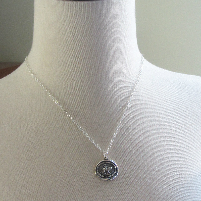 Cupid on a lion wax seal necklace on a mannequin