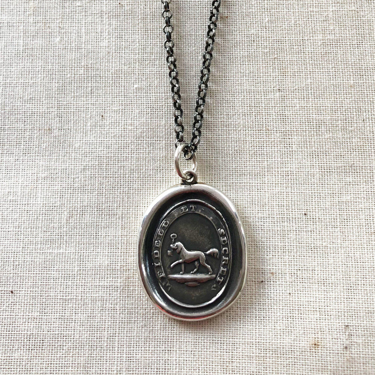 Friendship dog wax seal necklace close up view