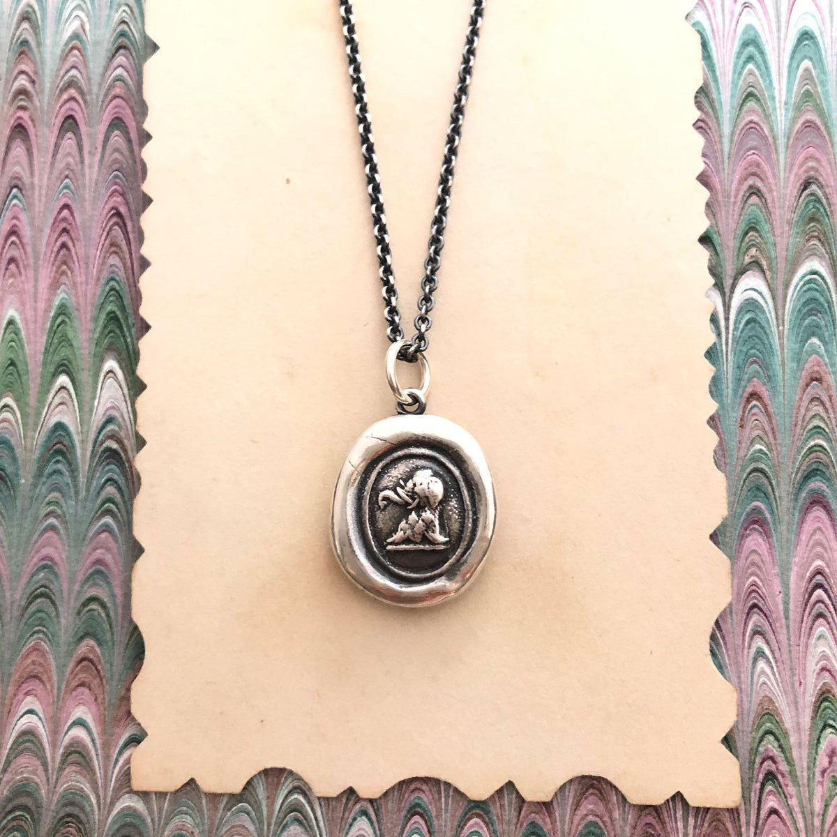 Elephant wax seal necklace on paper